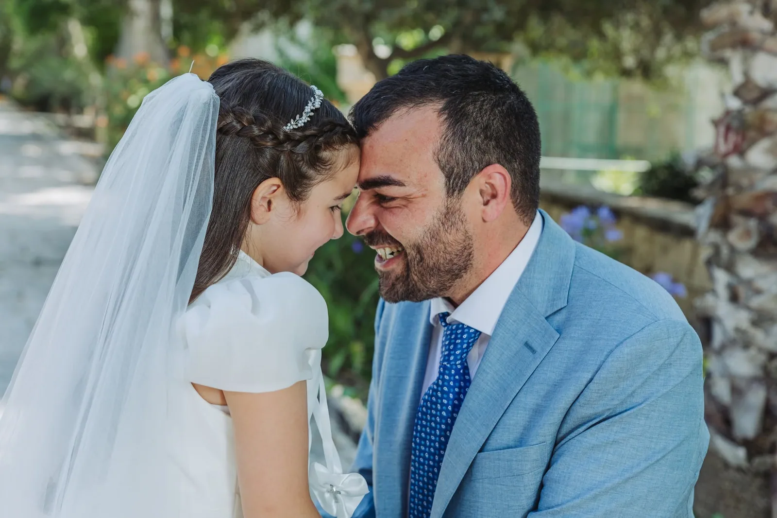father and communion daughter forehead to forehead malta