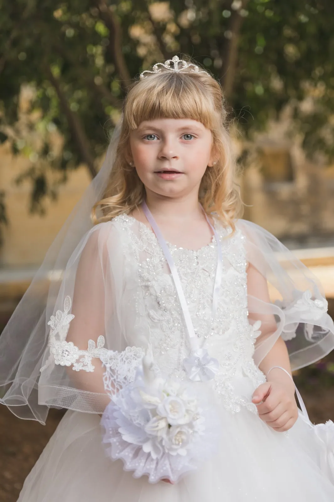 first communion girl with floral candle malta