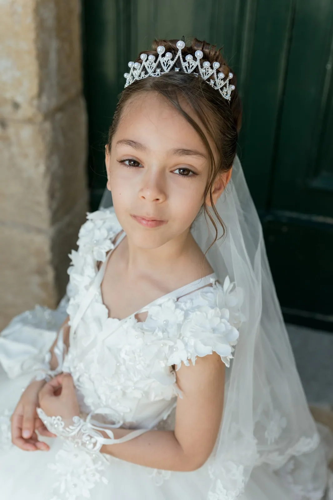 first communion girl with tiara by green door malta