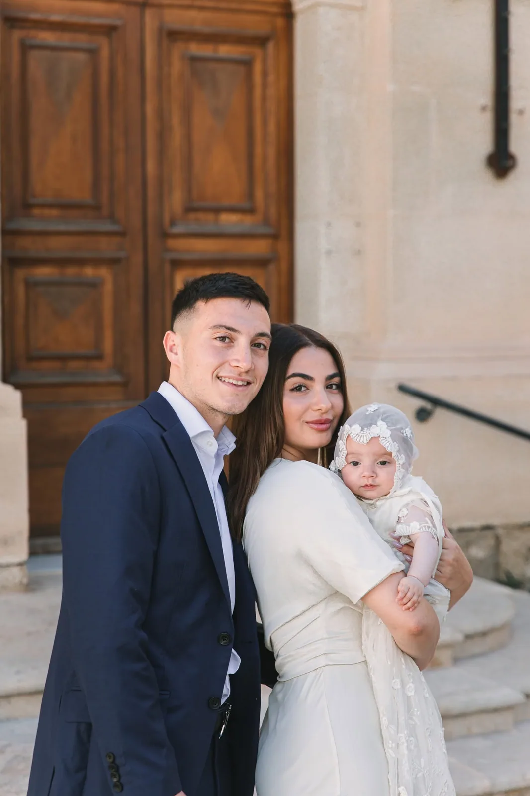 parents and baby outside church malta