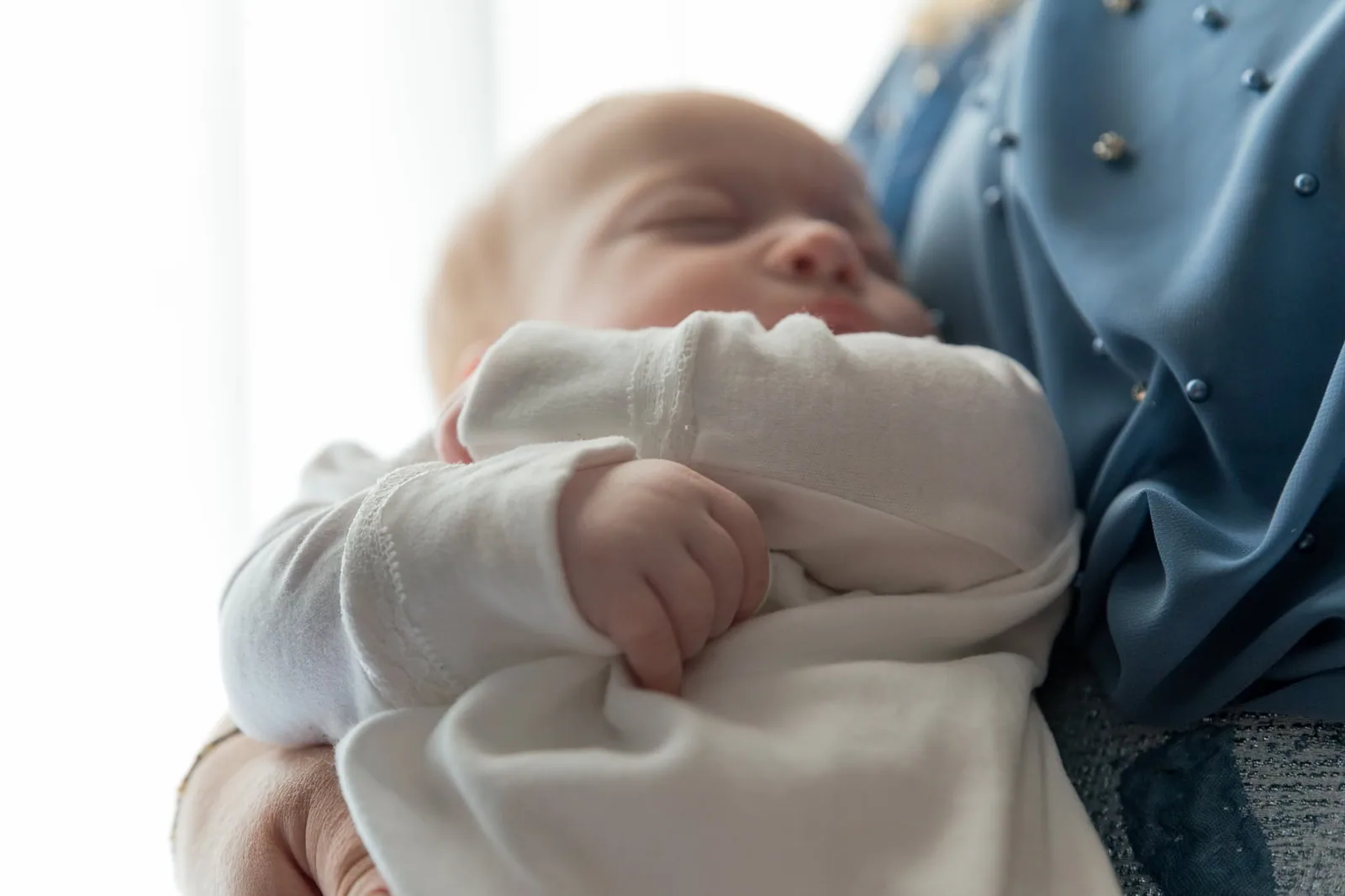 sleeping baby in mothers arms malta