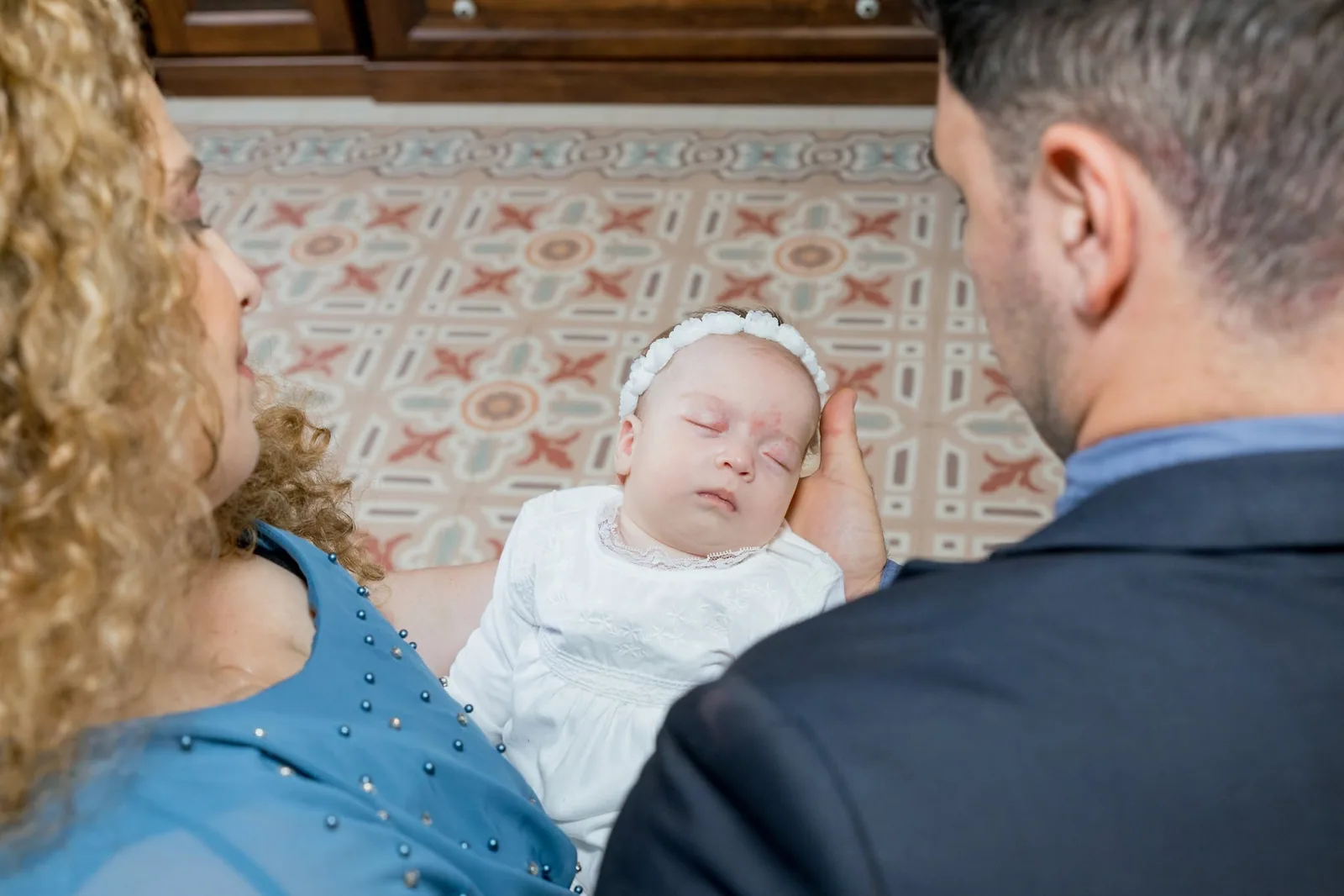 sleeping baby with parents before baptism malta