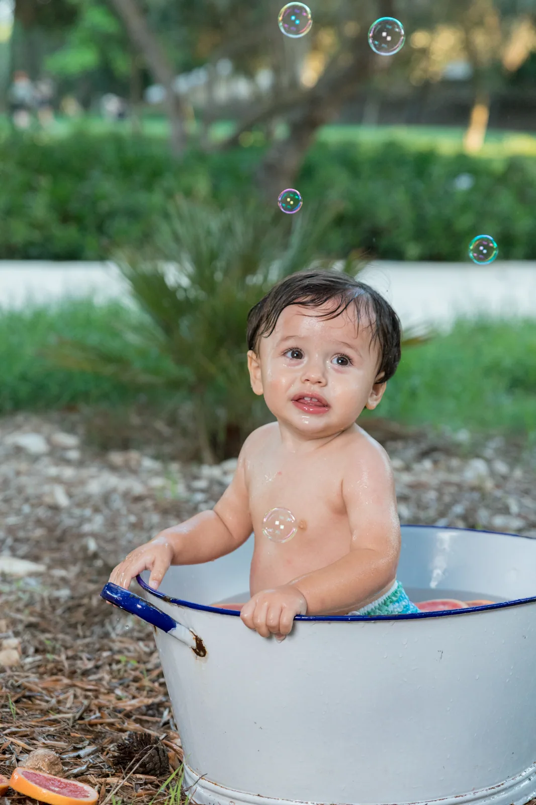 baby in white bathtub in garden malta