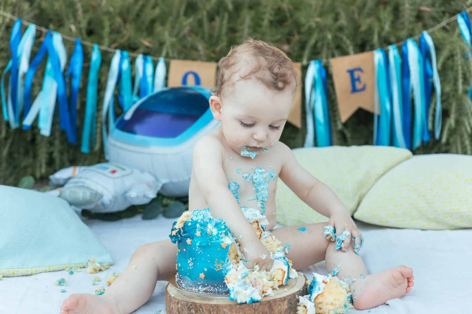 baby playing with blue birthday cake malta
