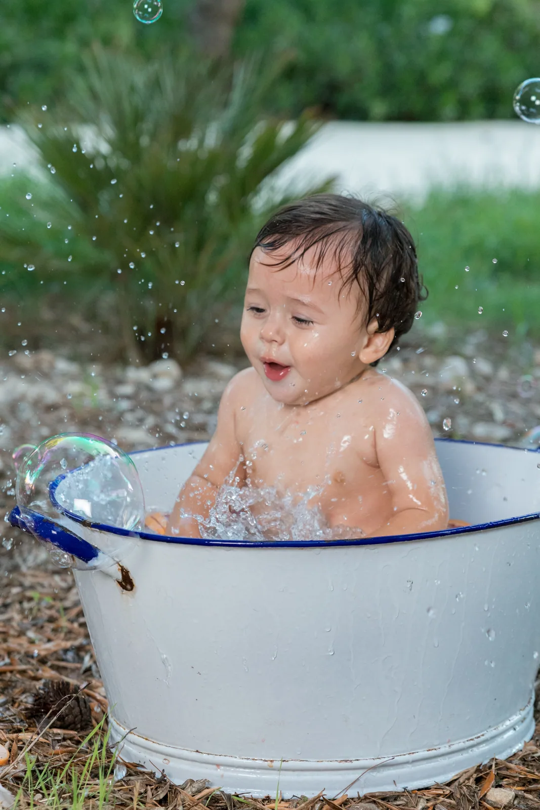 baby splashing in garden bathtub malta