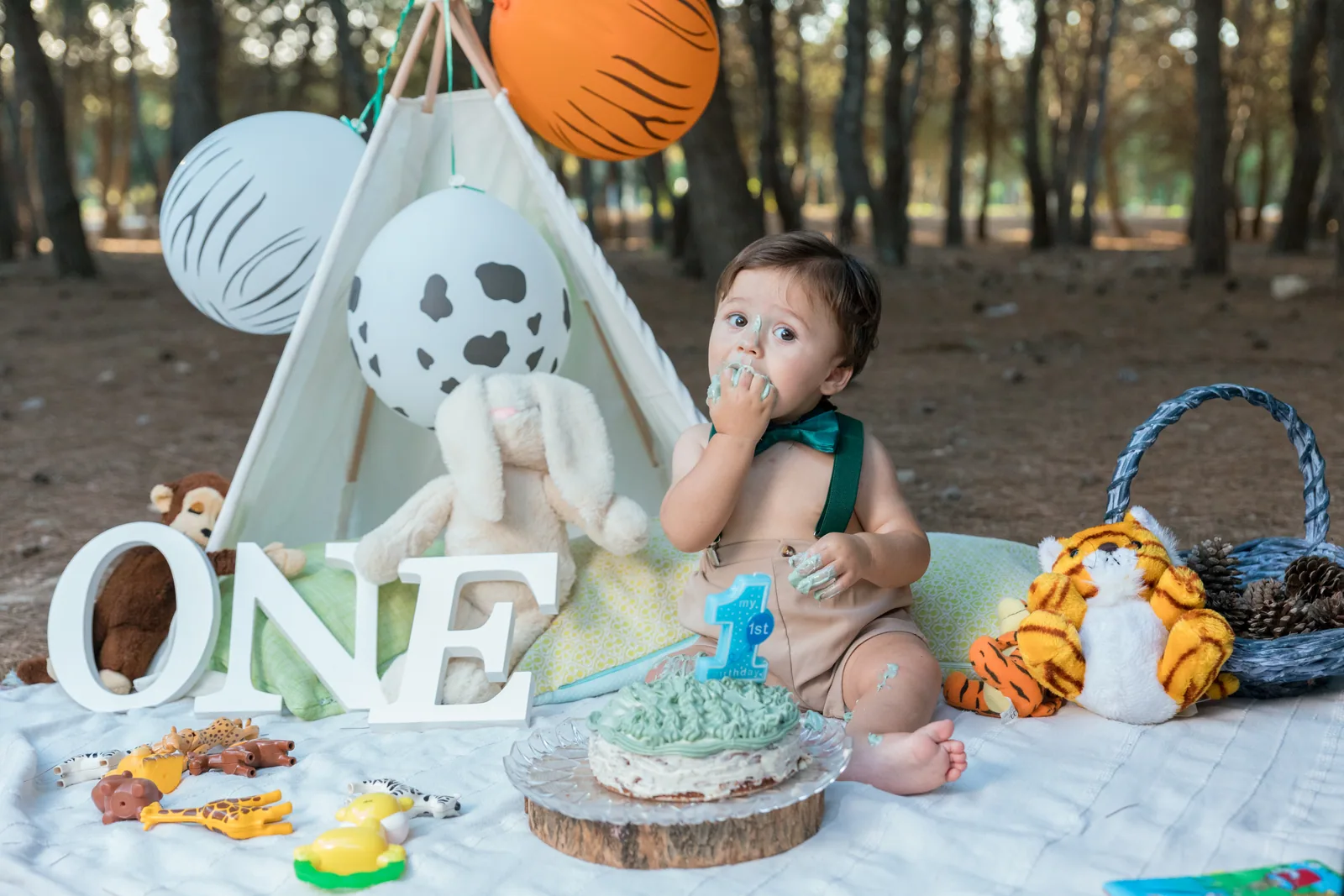 baby tasting first birthday cake in woodland malta