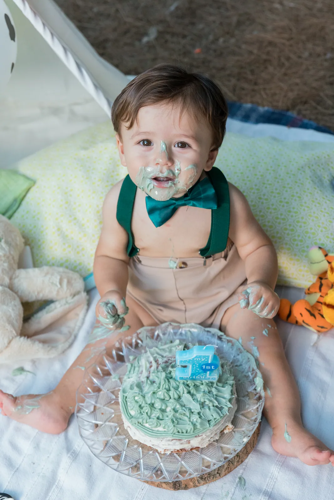 smiling baby with blue cake and green bow tie malta