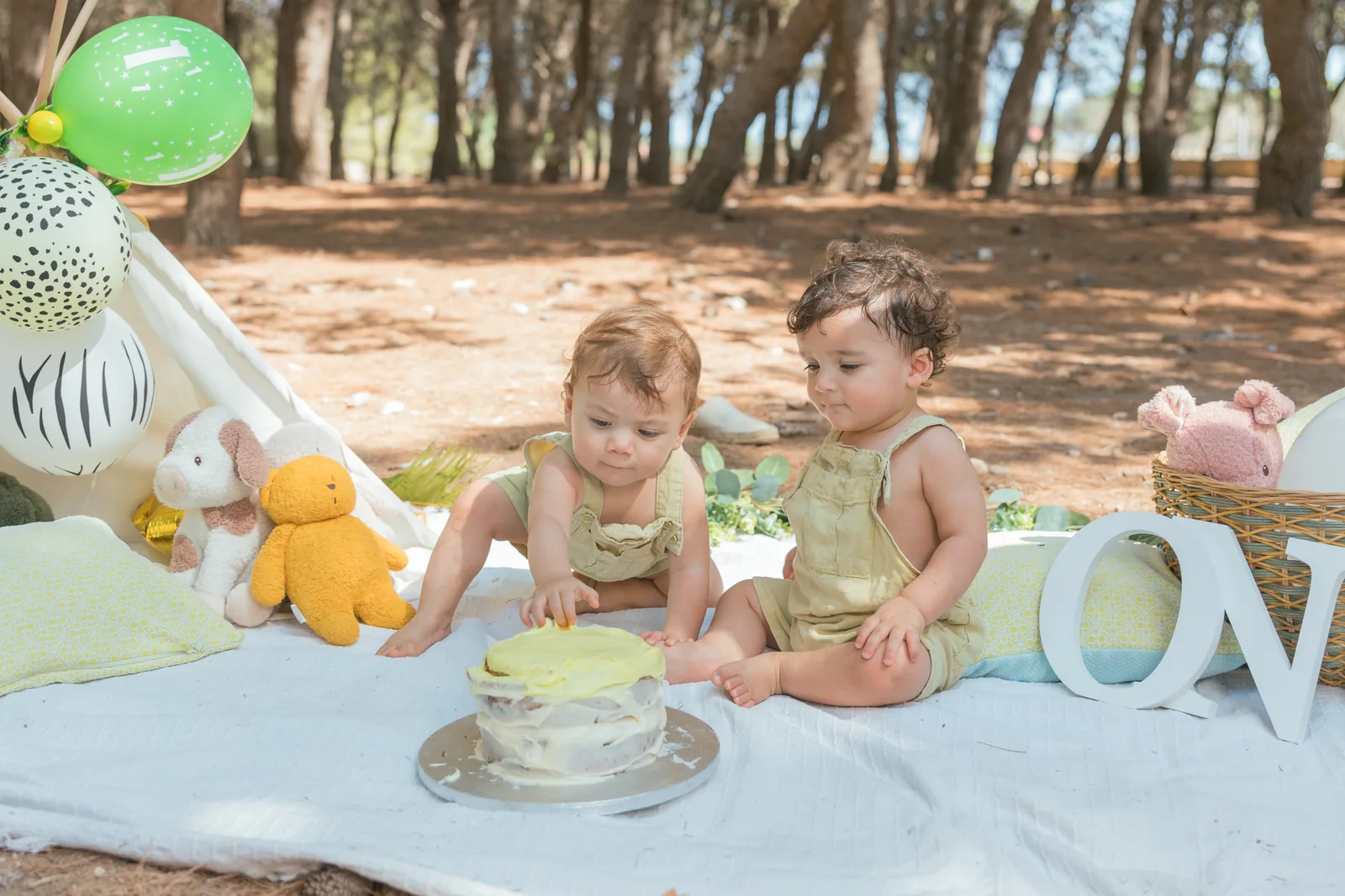 two babies sharing first birthday cake malta