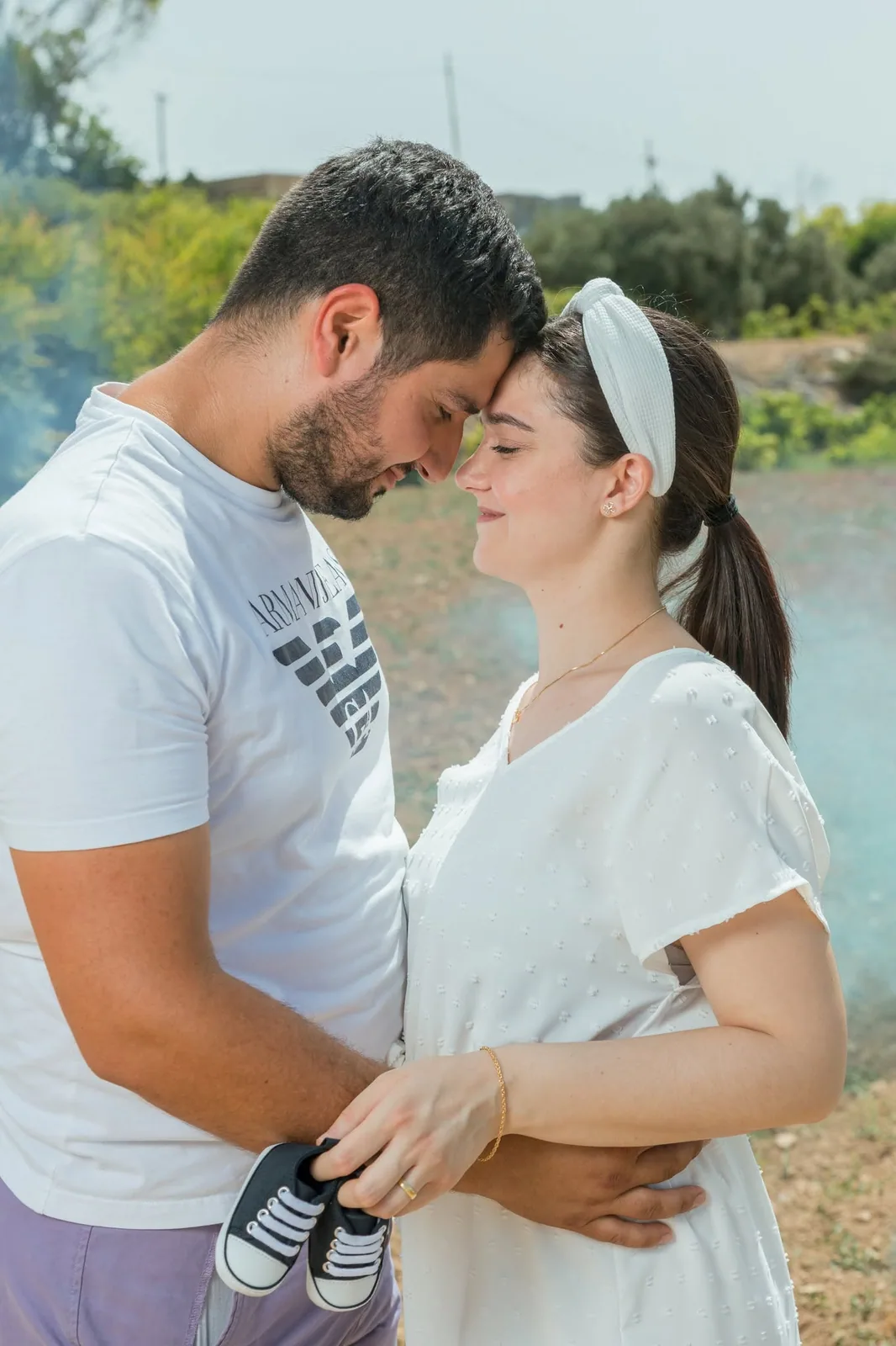 couple touching foreheads at gender reveal malta