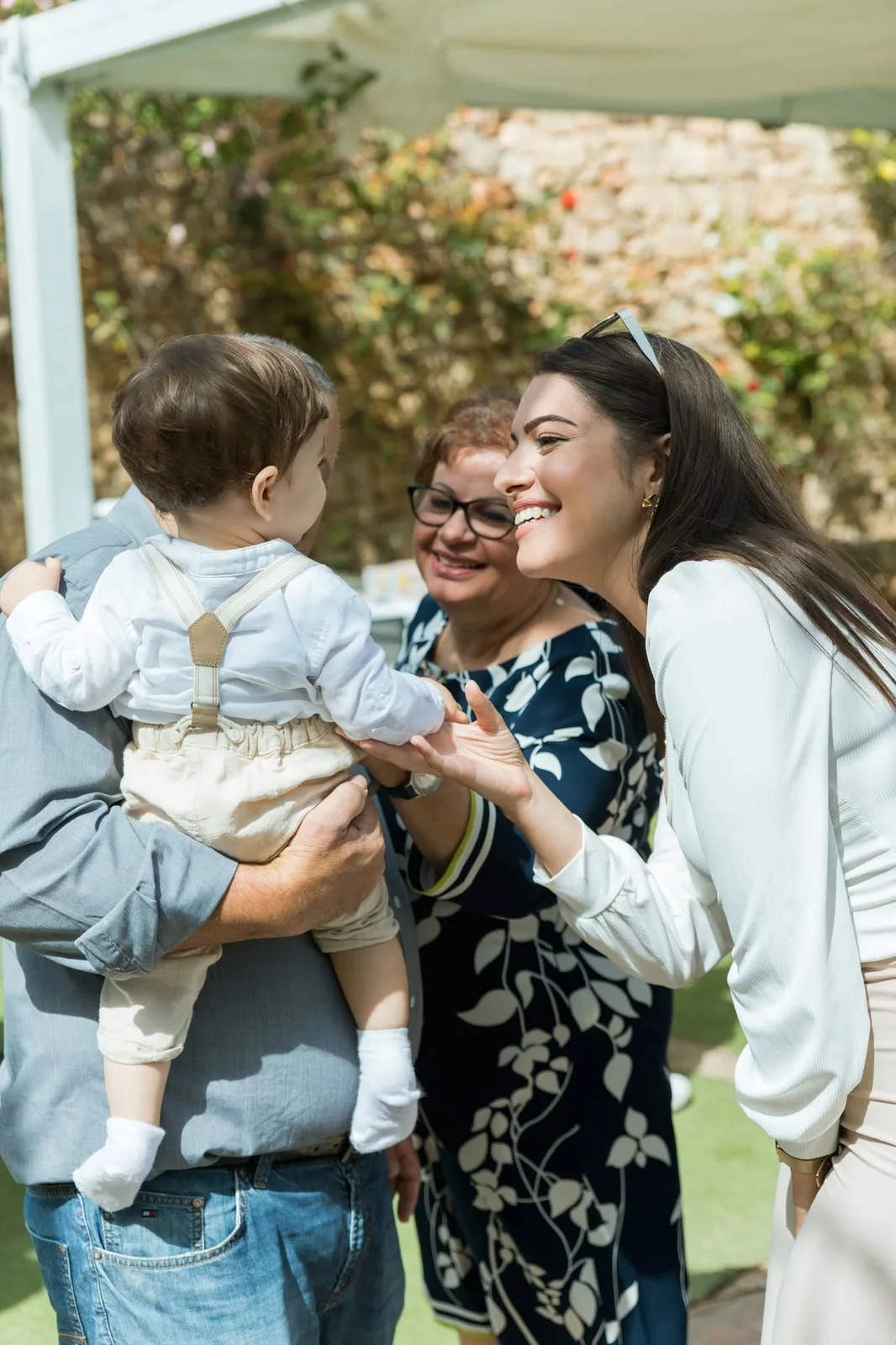 family greeting toddler at garden party malta