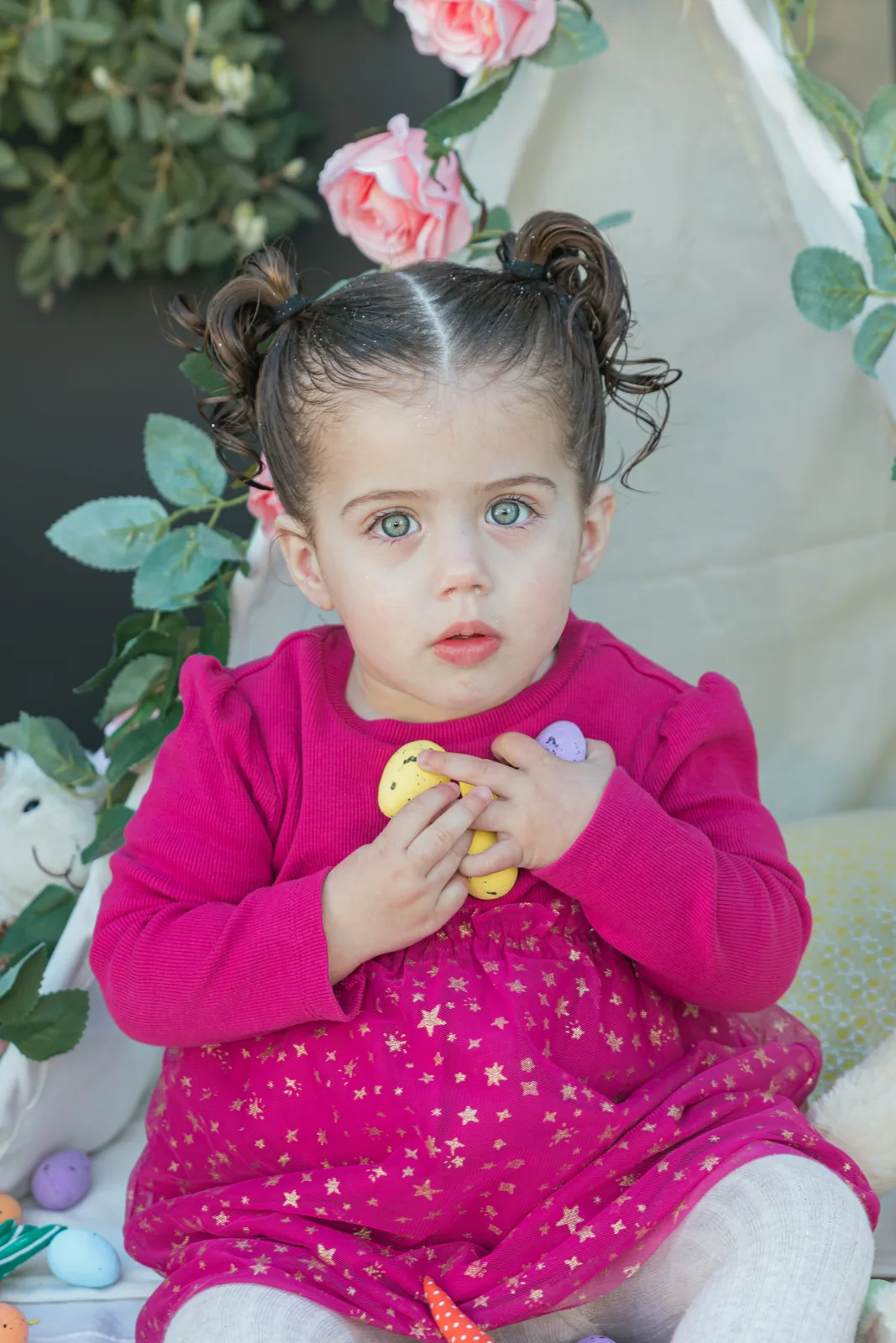 girl in pink dress at floral teepee malta