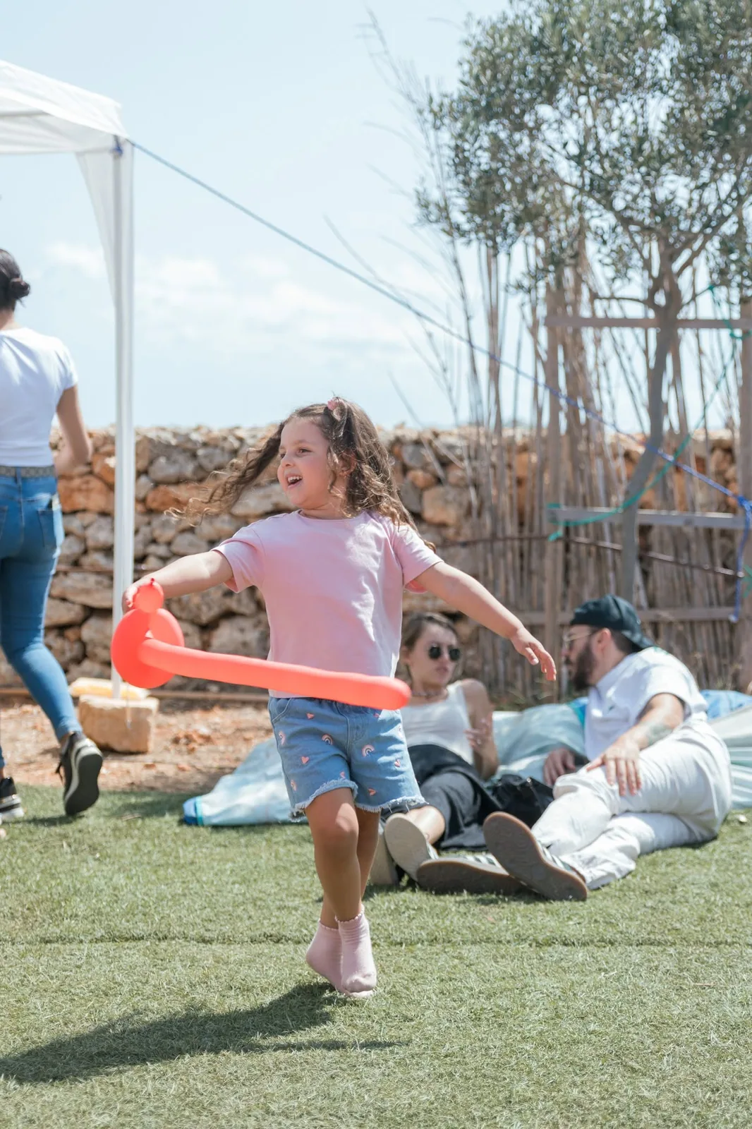 girl playing with hula hoop malta