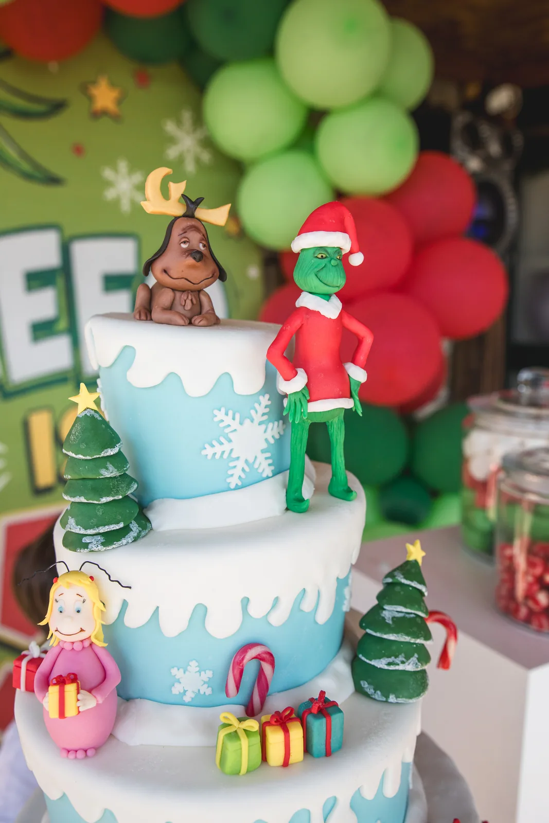 Jungle-themed tiered birthday cake with colourful balloons in Malta