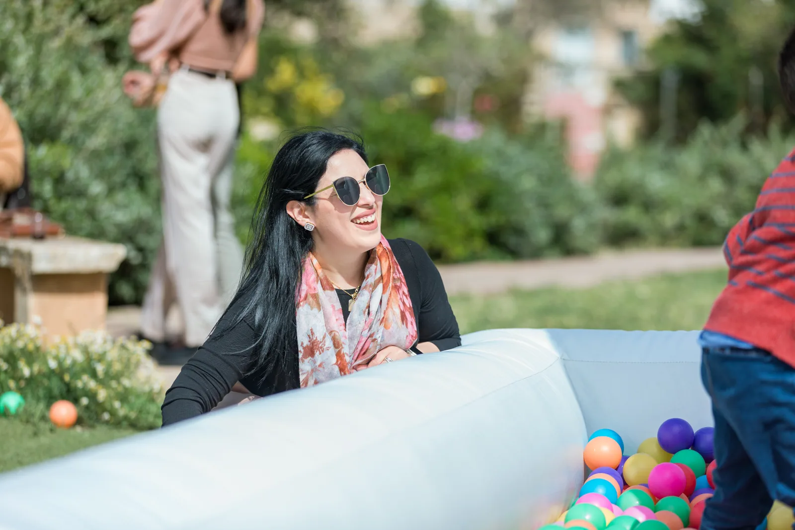 woman beside ball pit at garden party malta