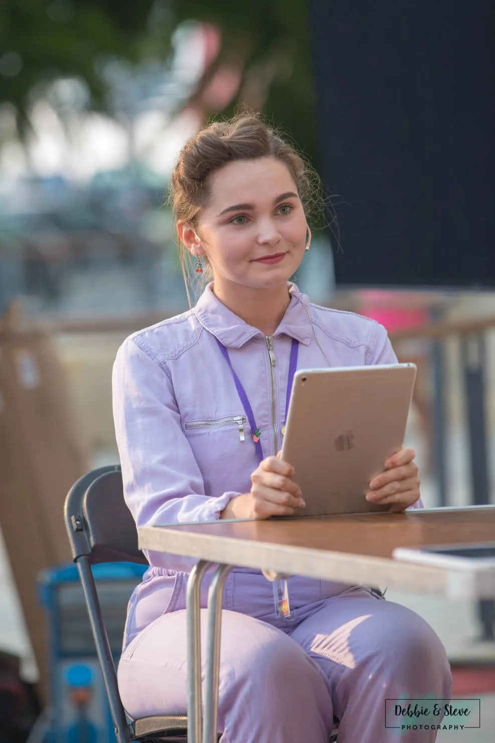 woman reading tablet at outdoor event malta