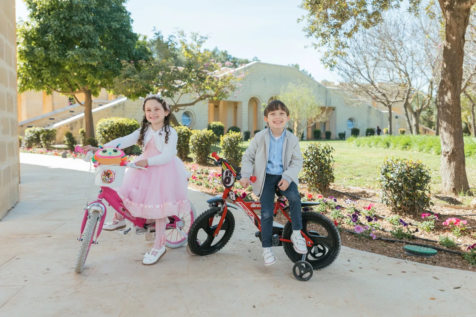 children with bicycles in garden malta