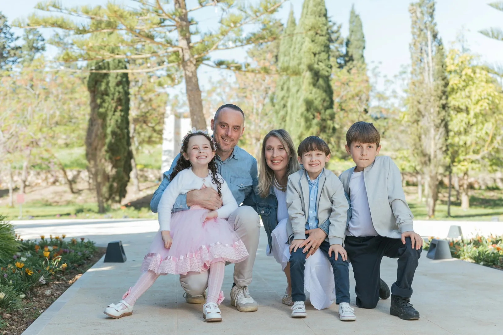 family of five seated in garden malta