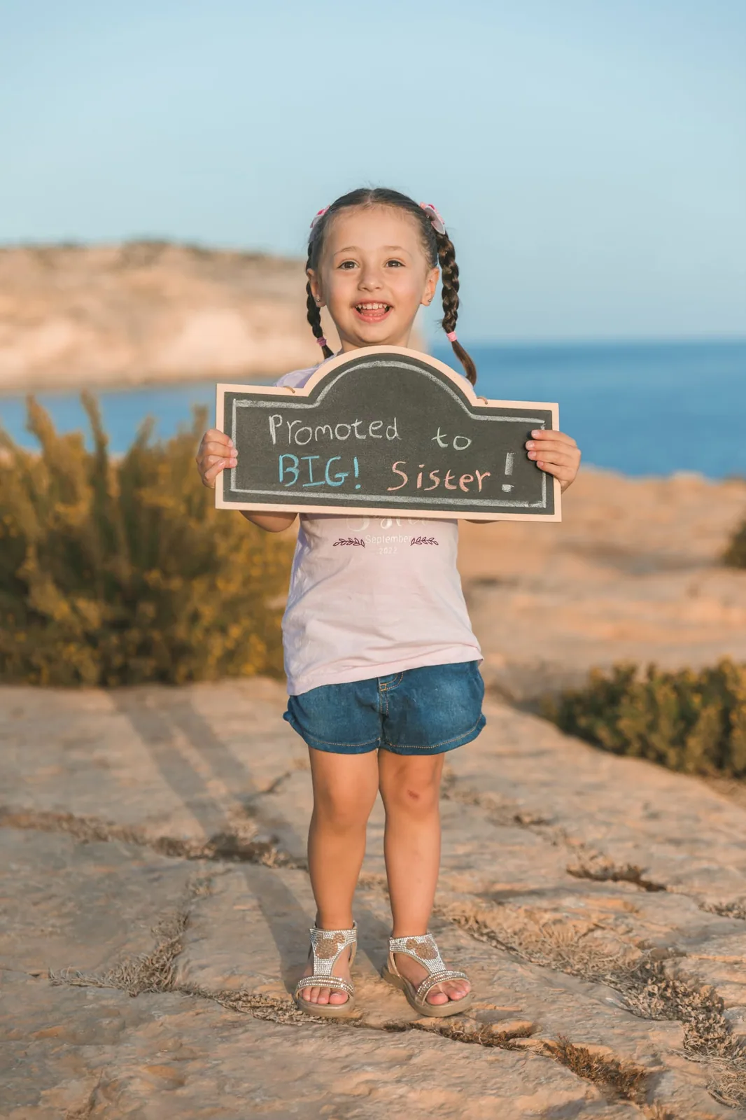girl holding big sister announcement malta