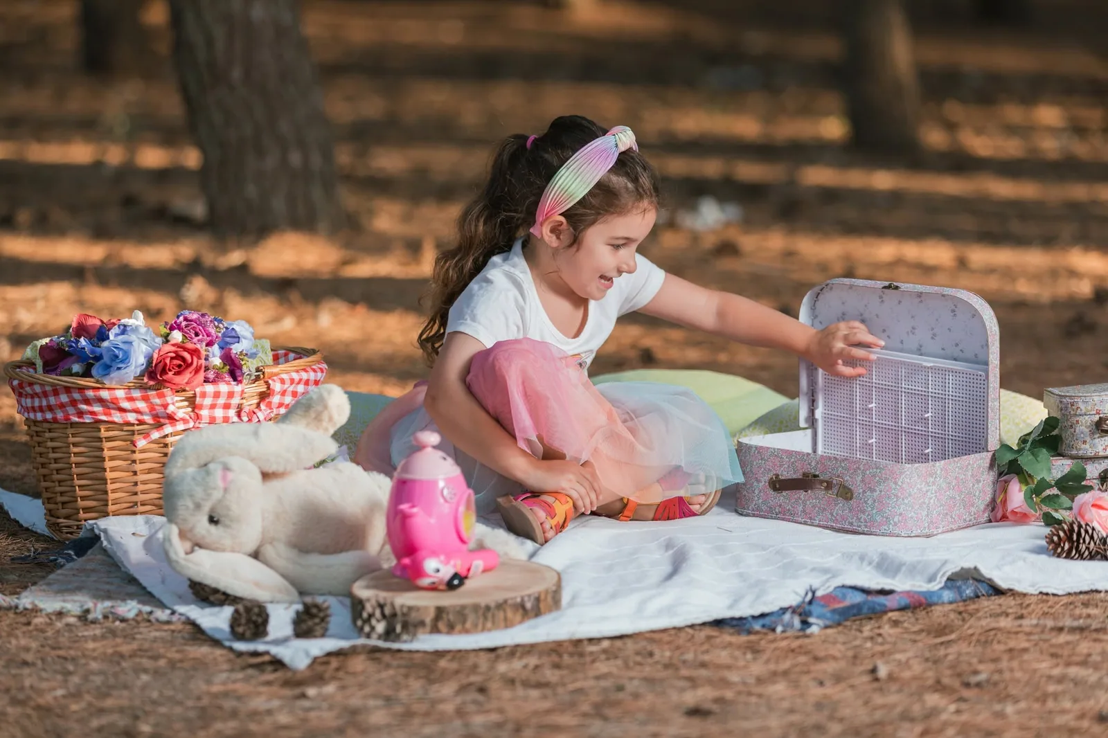 girl with toy kitchen at woodland picnic malta