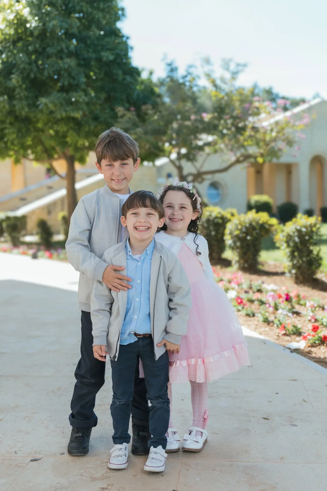 three children posing in garden malta