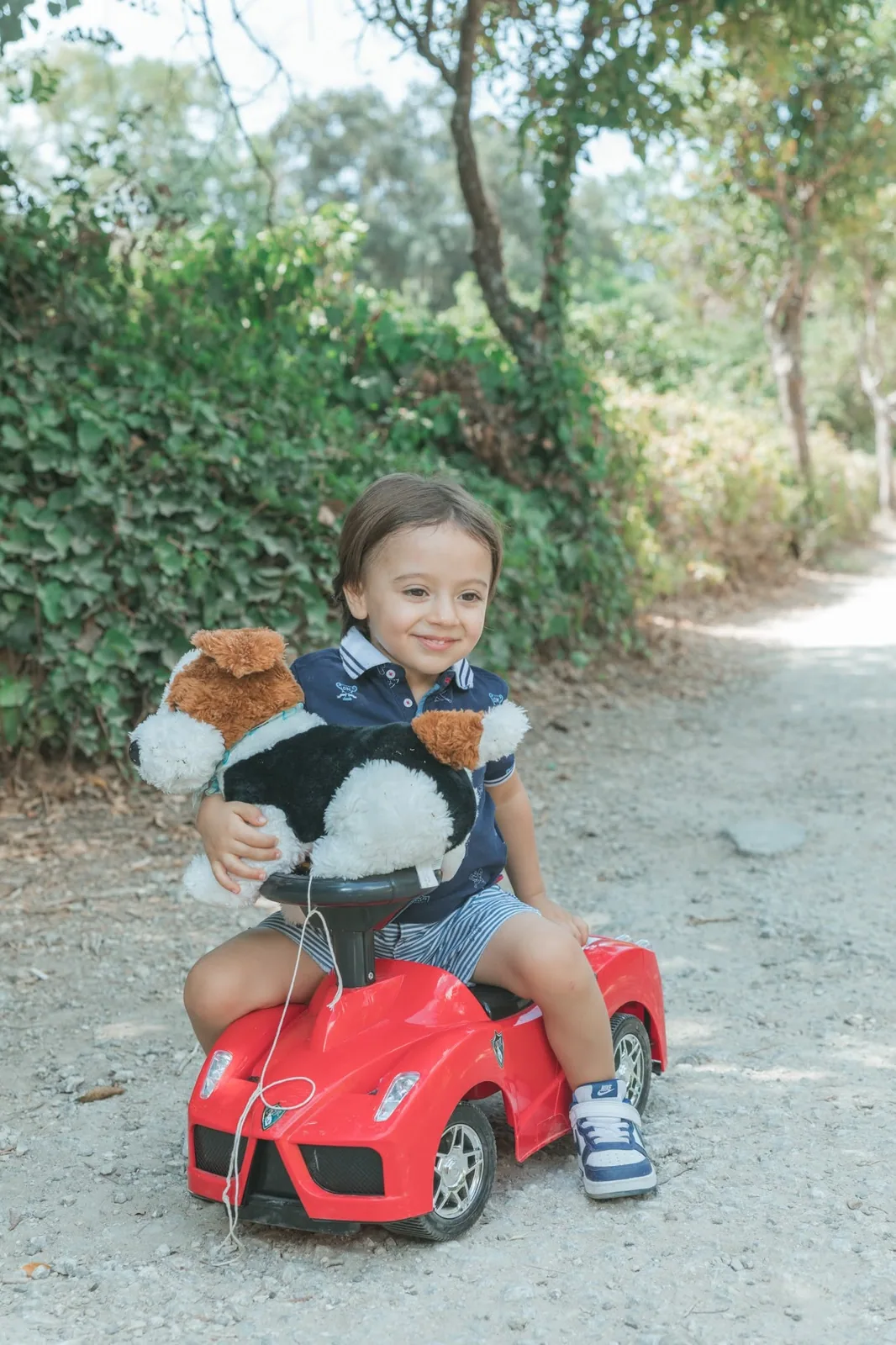toddler in red toy car malta