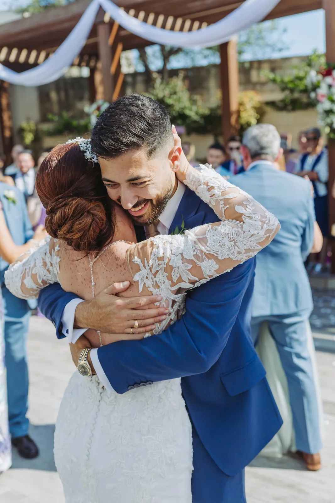 bride and groom embracing at reception malta
