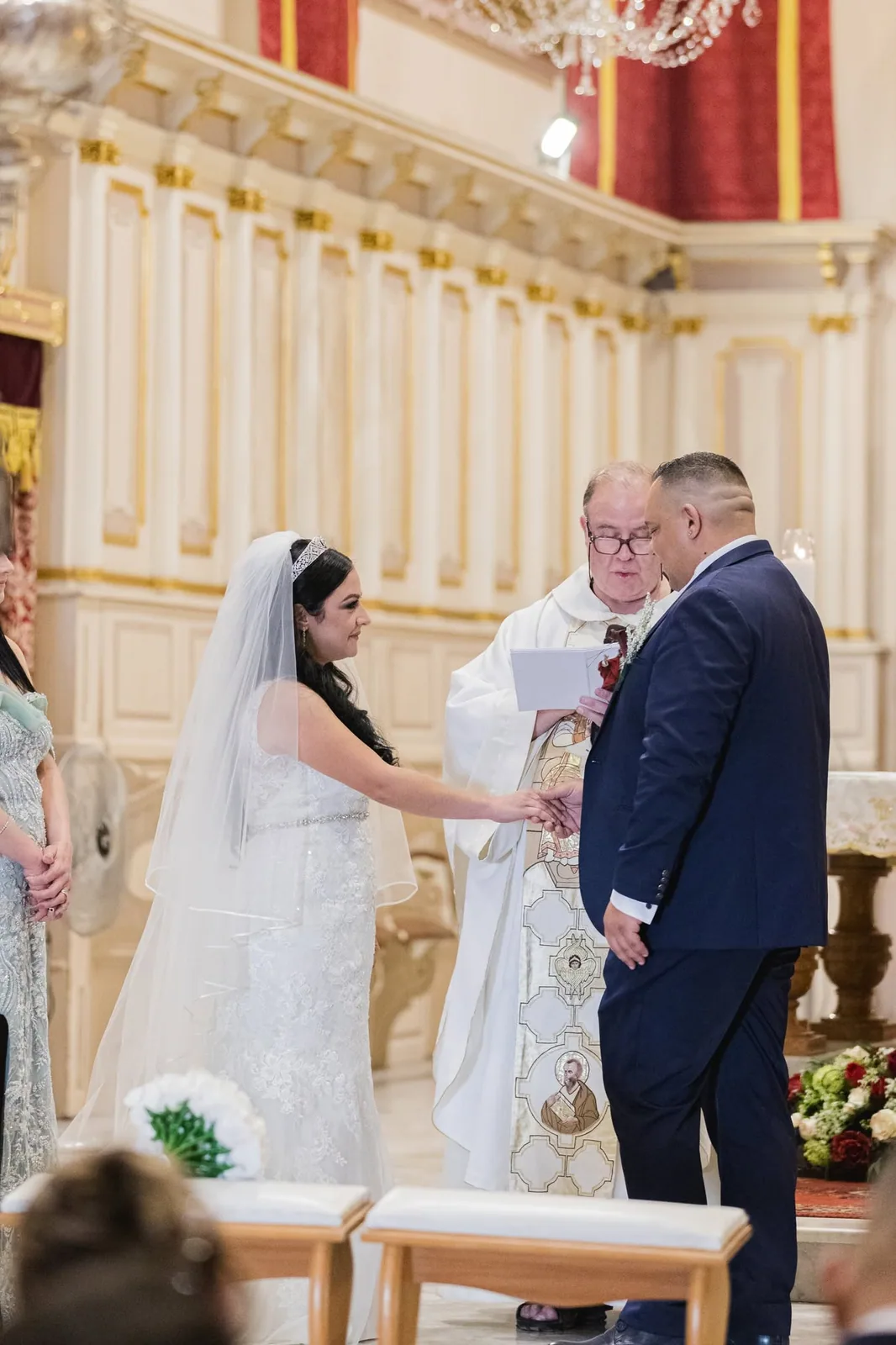 bride and groom exchanging rings in church malta