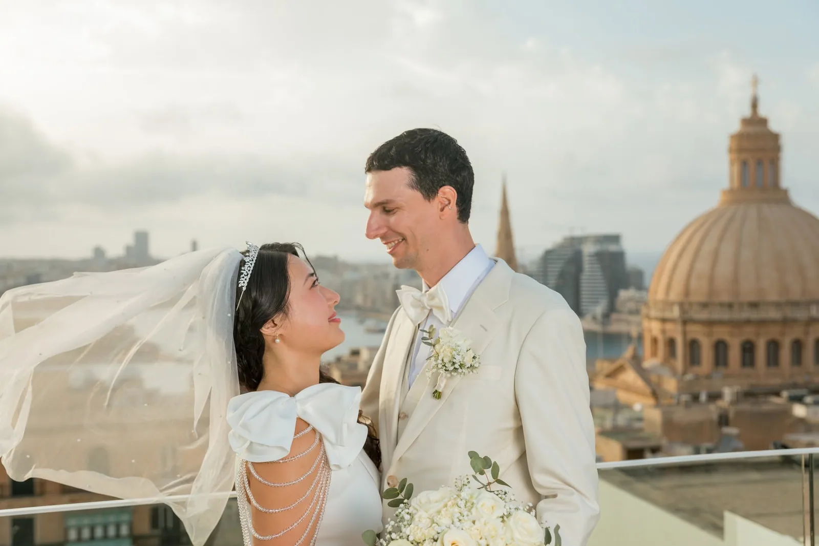 bride and groom with windswept veil malta