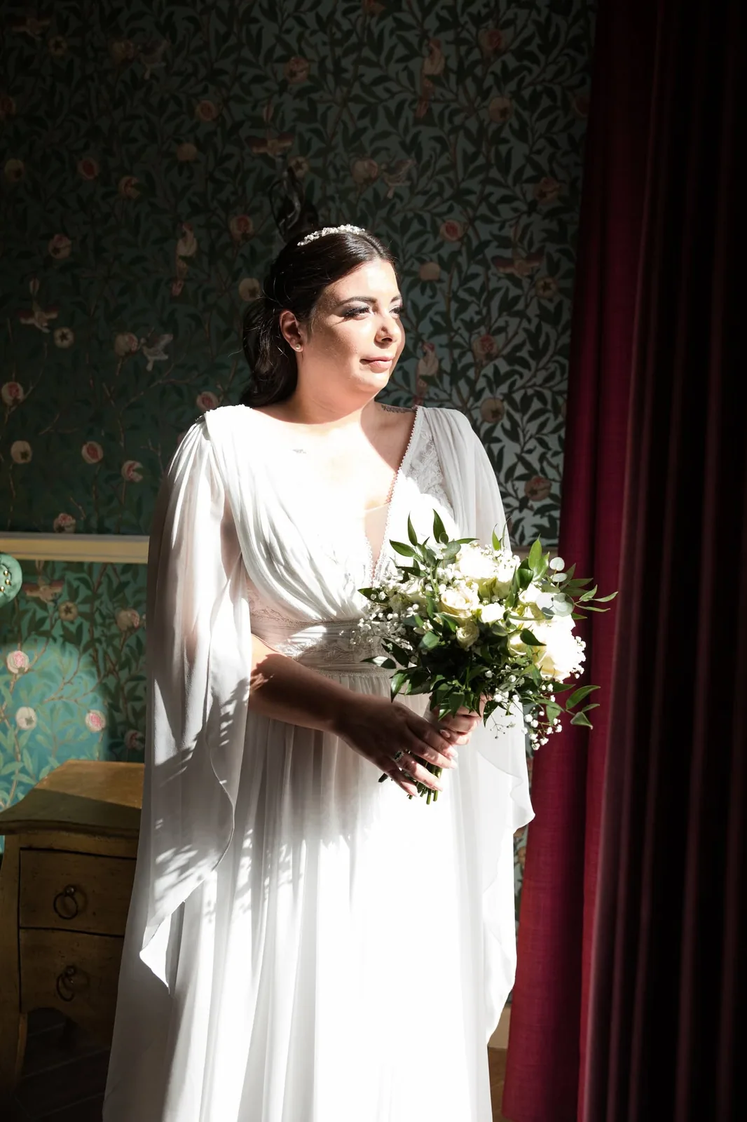 bride with bouquet in window light malta