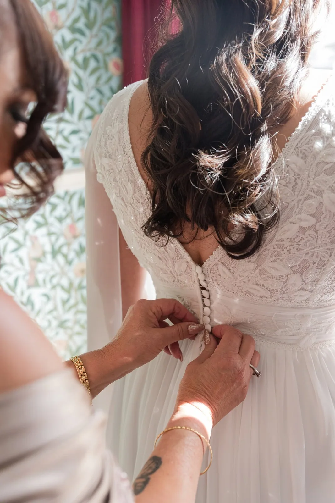 fastening buttons on brides wedding dress malta