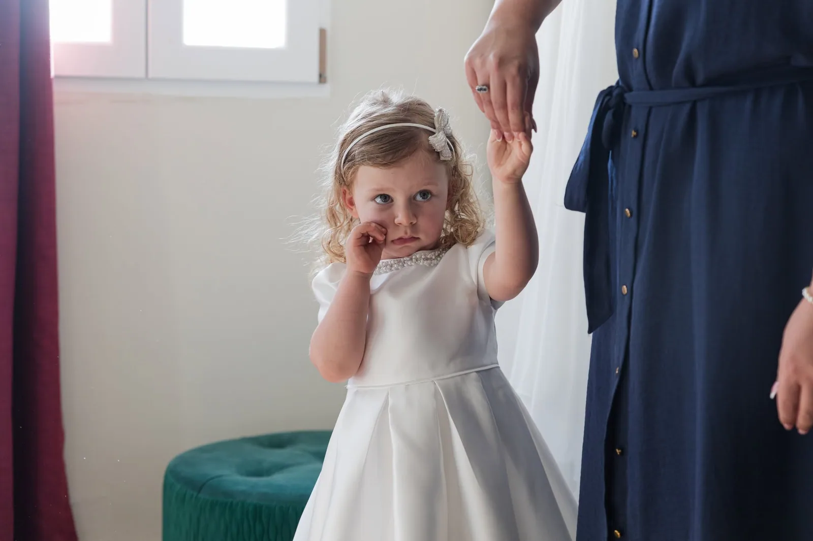 flower girl holding adults hand malta