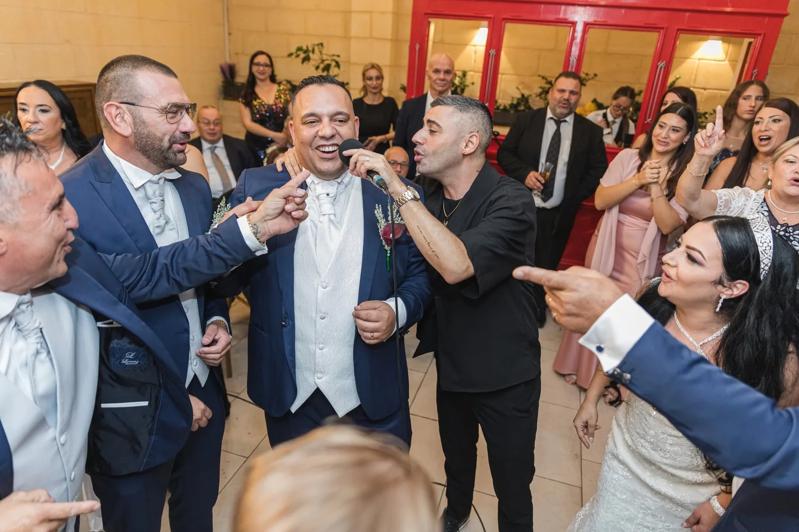 groom celebrating with wedding guests malta