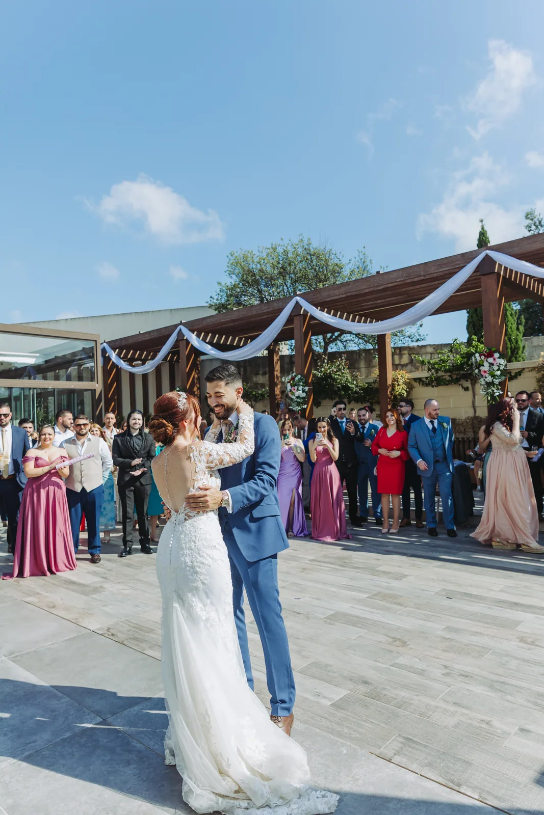 newlyweds dancing at outdoor reception malta