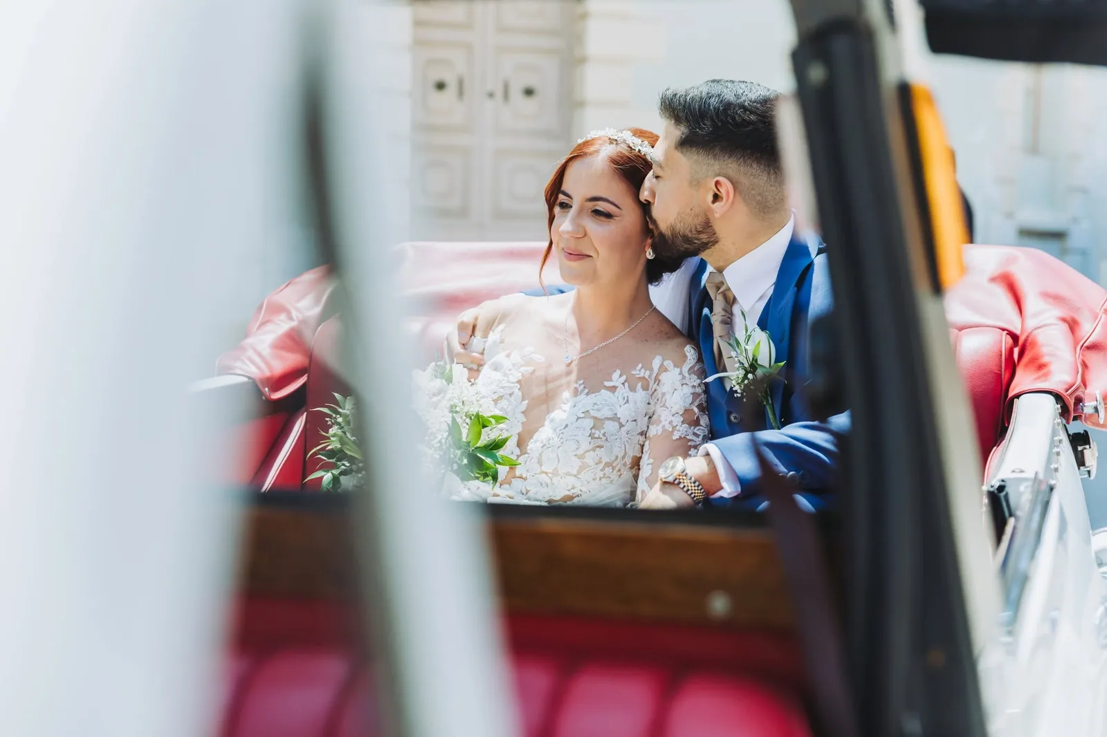 newlyweds in vintage wedding car malta