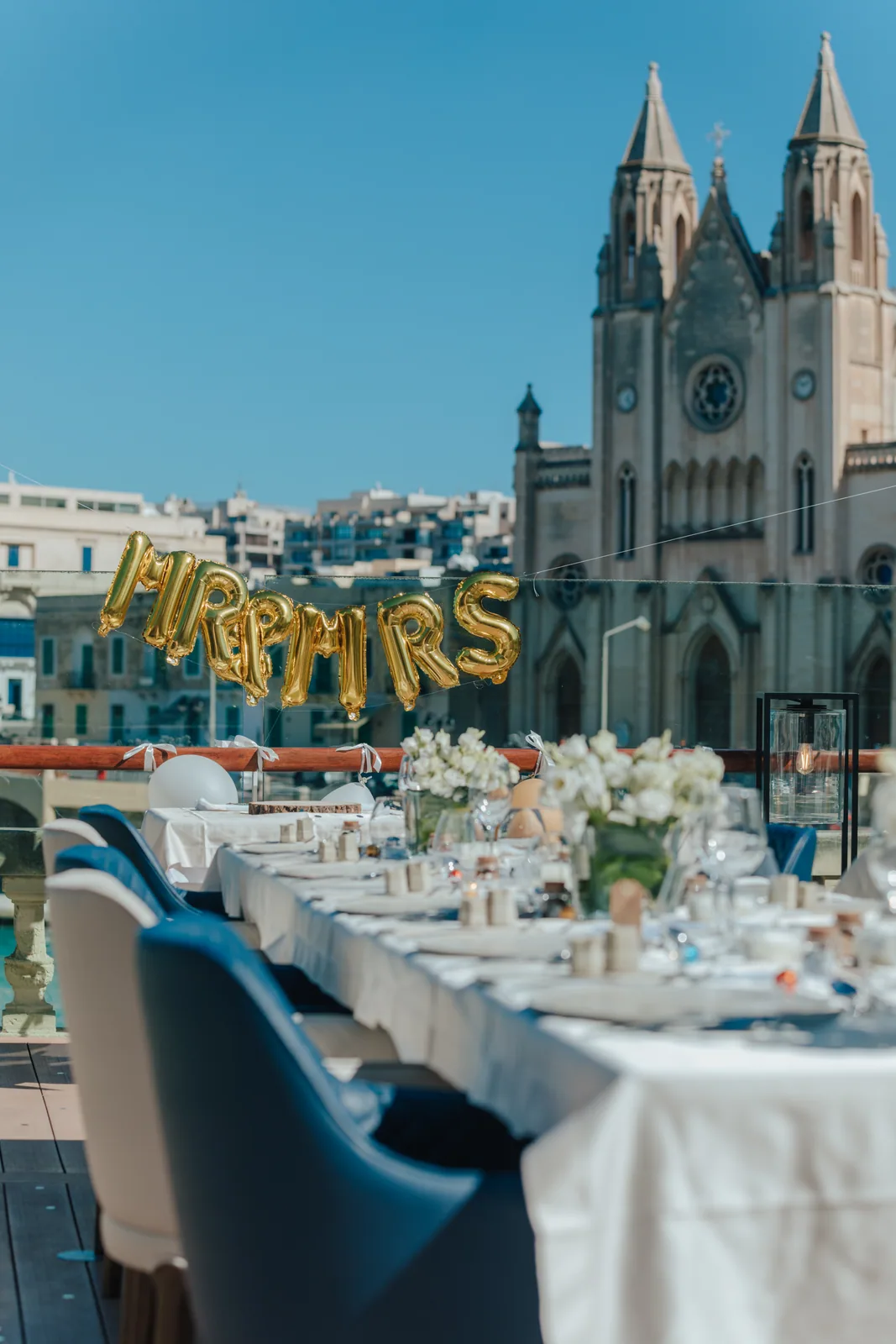 outdoor wedding reception tables beside church malta