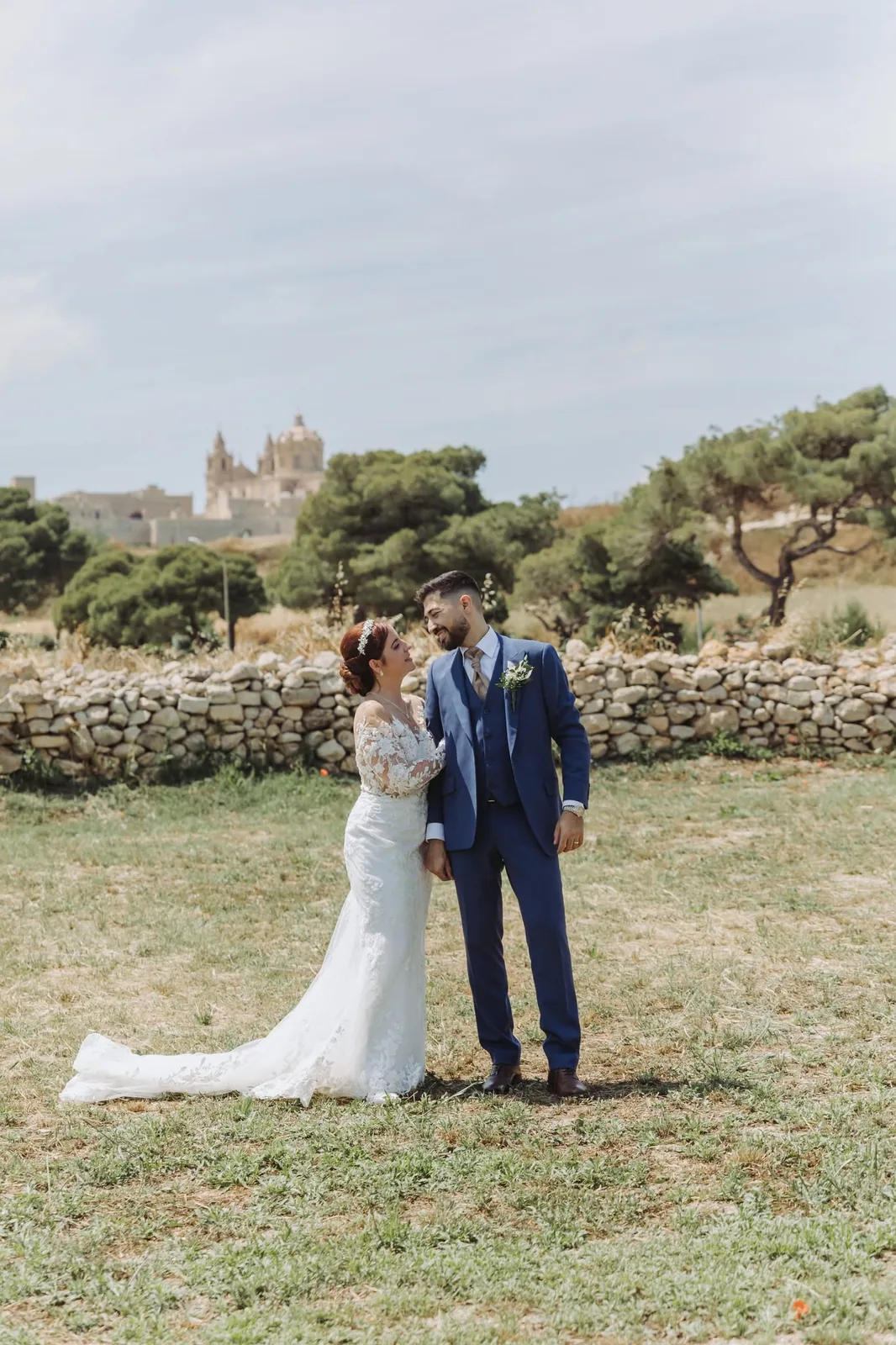 wedding couple in garden with dress train malta