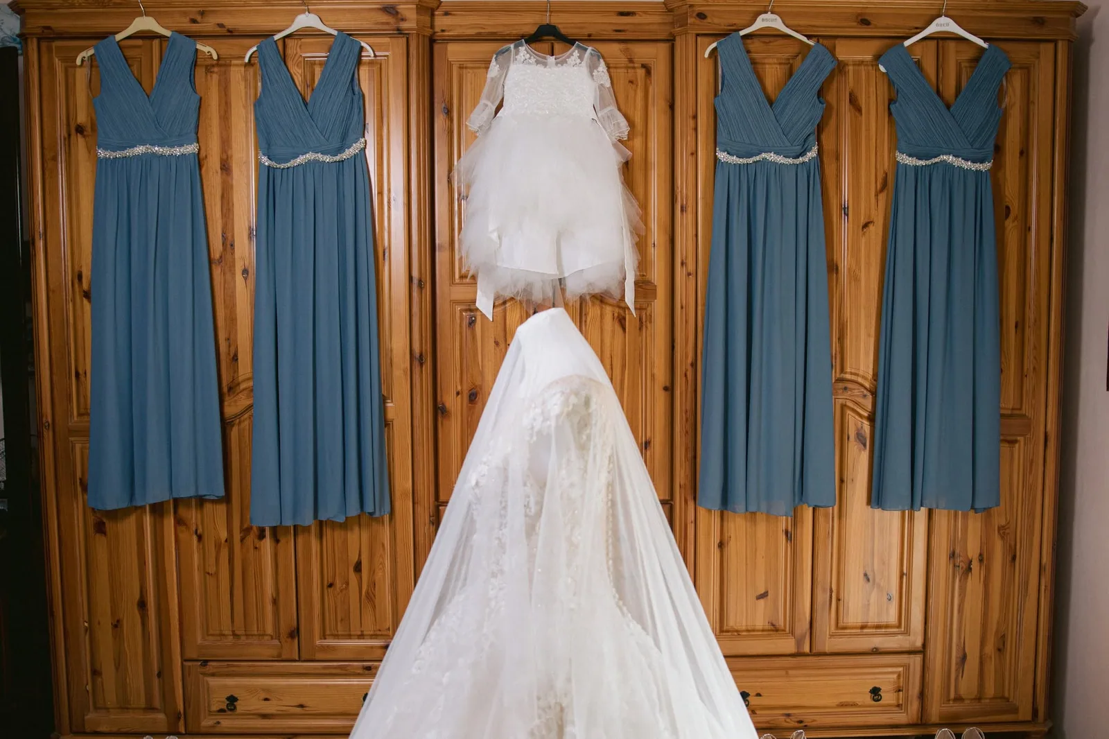 wedding dress hanging on wooden wardrobe malta