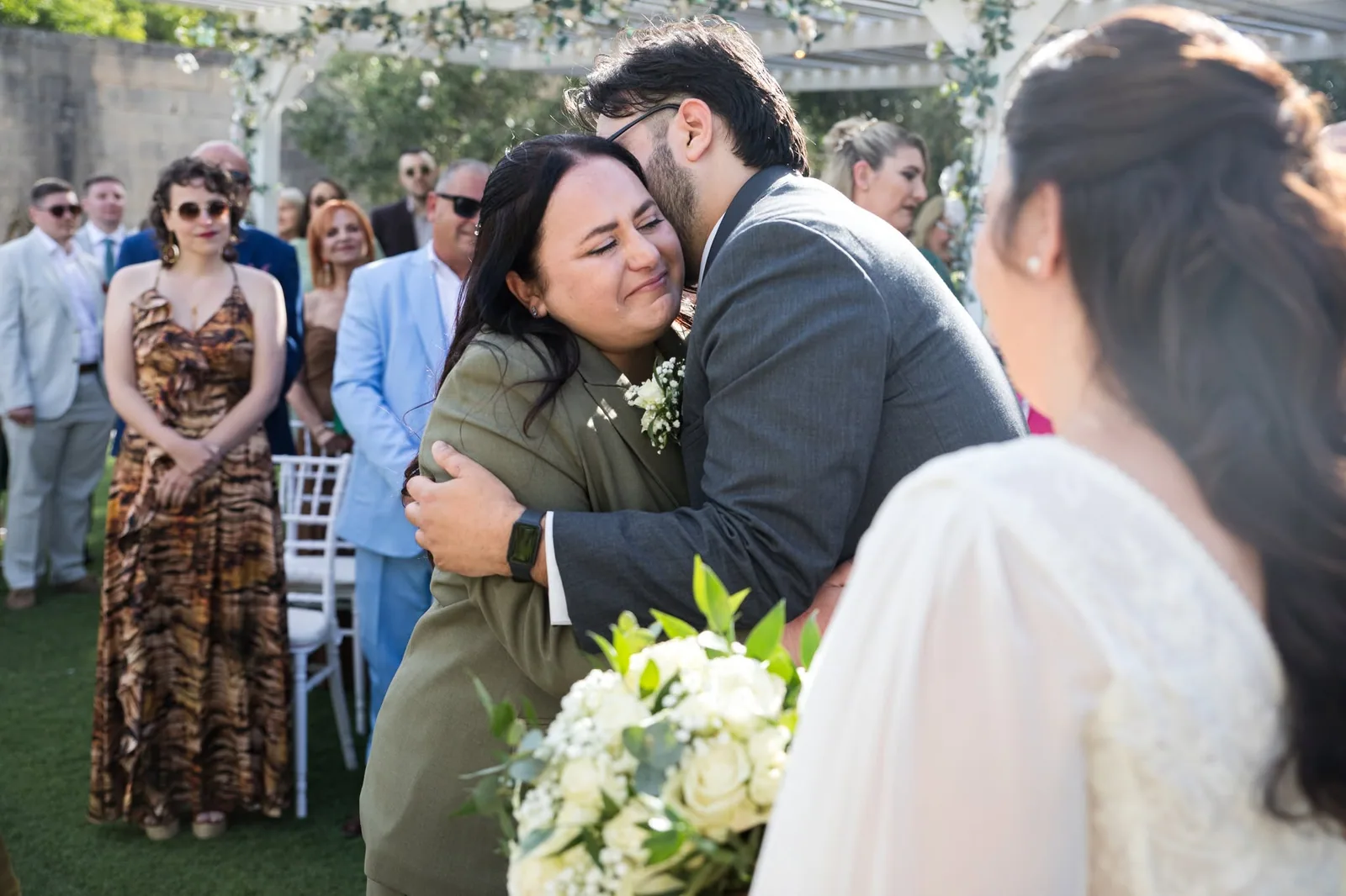 wedding guest greeting groom in garden malta
