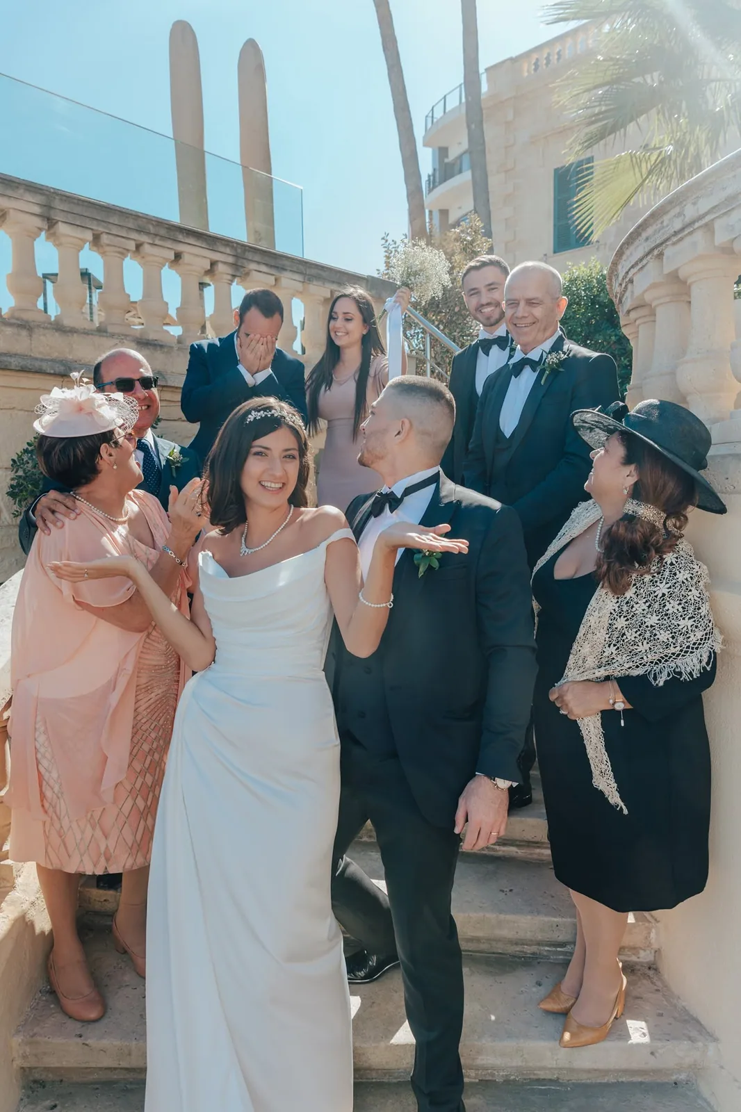 wedding party celebrating on stone steps malta