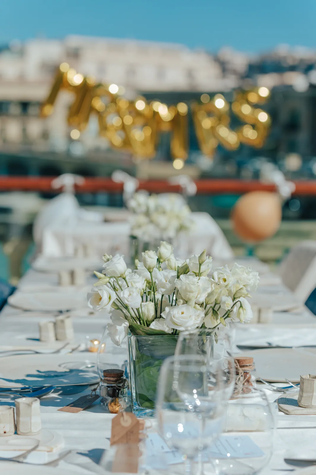 wedding reception table with white flower centrepiece malta